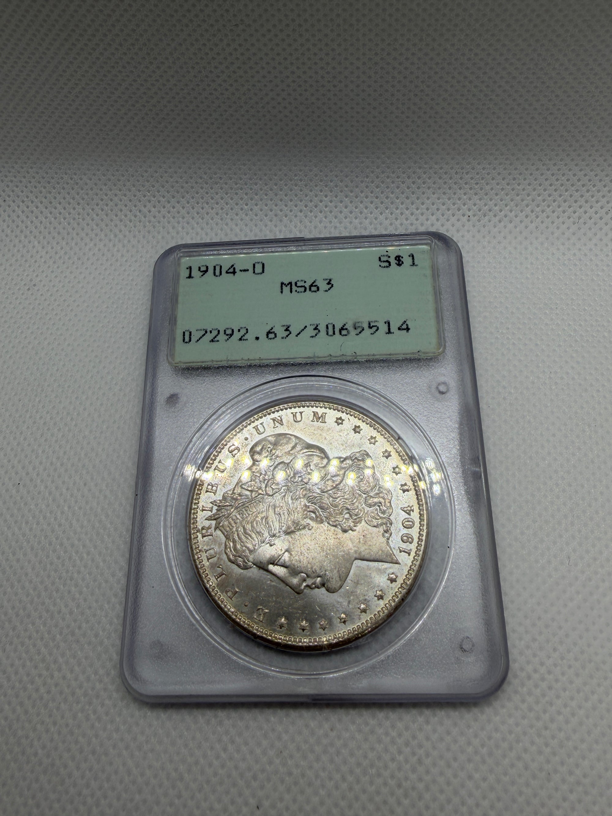 1904 O Morgan Silver Dollar – PCGS MS63 | Old Rattler Holder