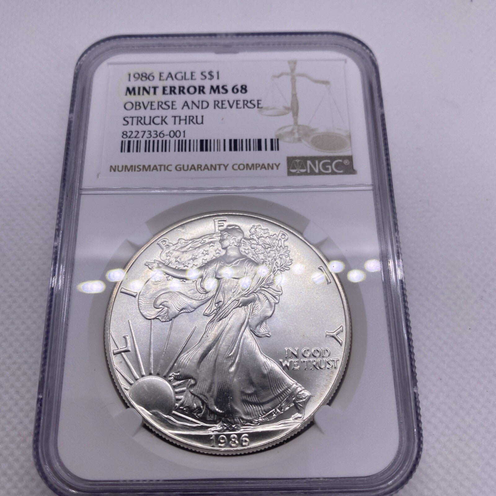 1986 $1 AMERICAN SILVER EAGLE NGC MS68 OBVERSE & REVERSE STRUCK THRU MINT ERROR