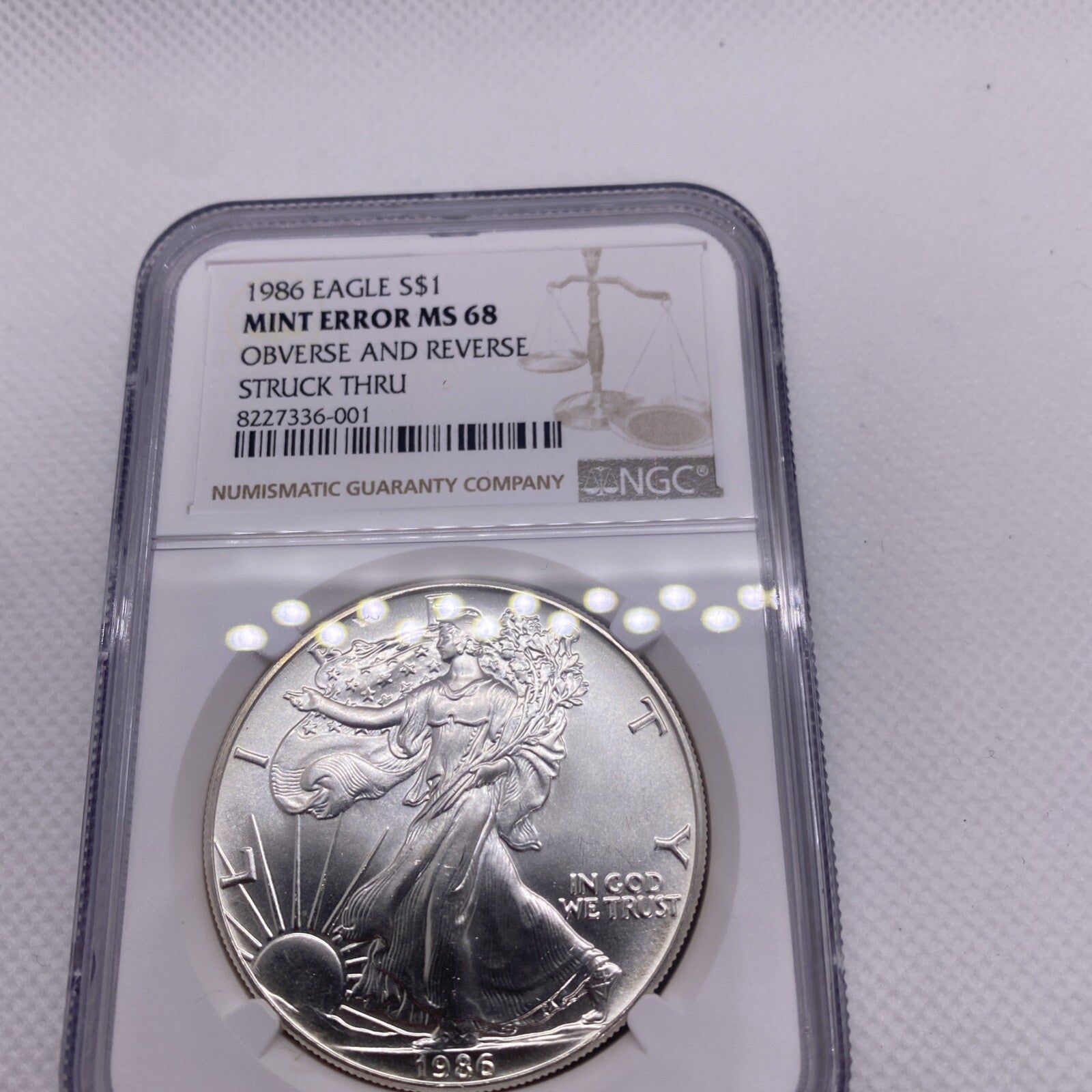 1986 $1 AMERICAN SILVER EAGLE NGC MS68 OBVERSE & REVERSE STRUCK THRU MINT ERROR