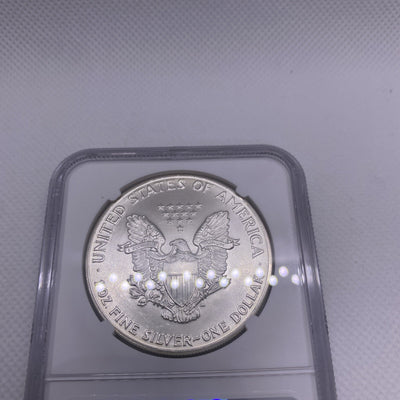 1986 $1 AMERICAN SILVER EAGLE NGC MS68 OBVERSE & REVERSE STRUCK THRU MINT ERROR