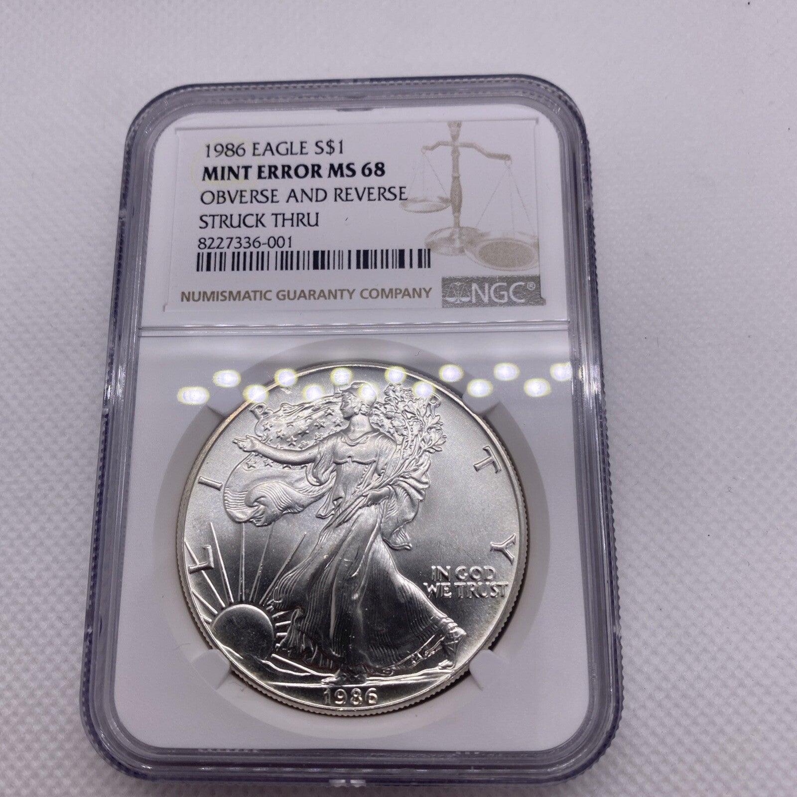 1986 $1 AMERICAN SILVER EAGLE NGC MS68 OBVERSE & REVERSE STRUCK THRU MINT ERROR