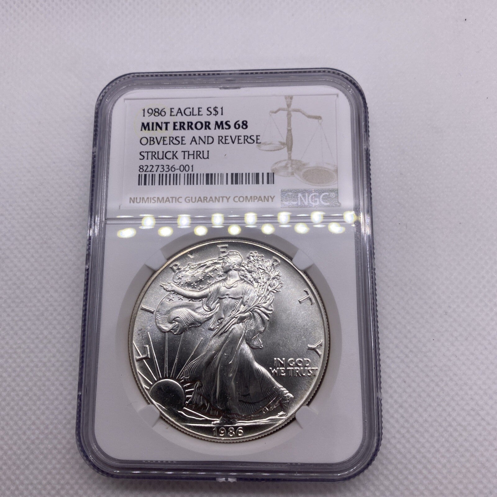 1986 $1 AMERICAN SILVER EAGLE NGC MS68 OBVERSE & REVERSE STRUCK THRU MINT ERROR