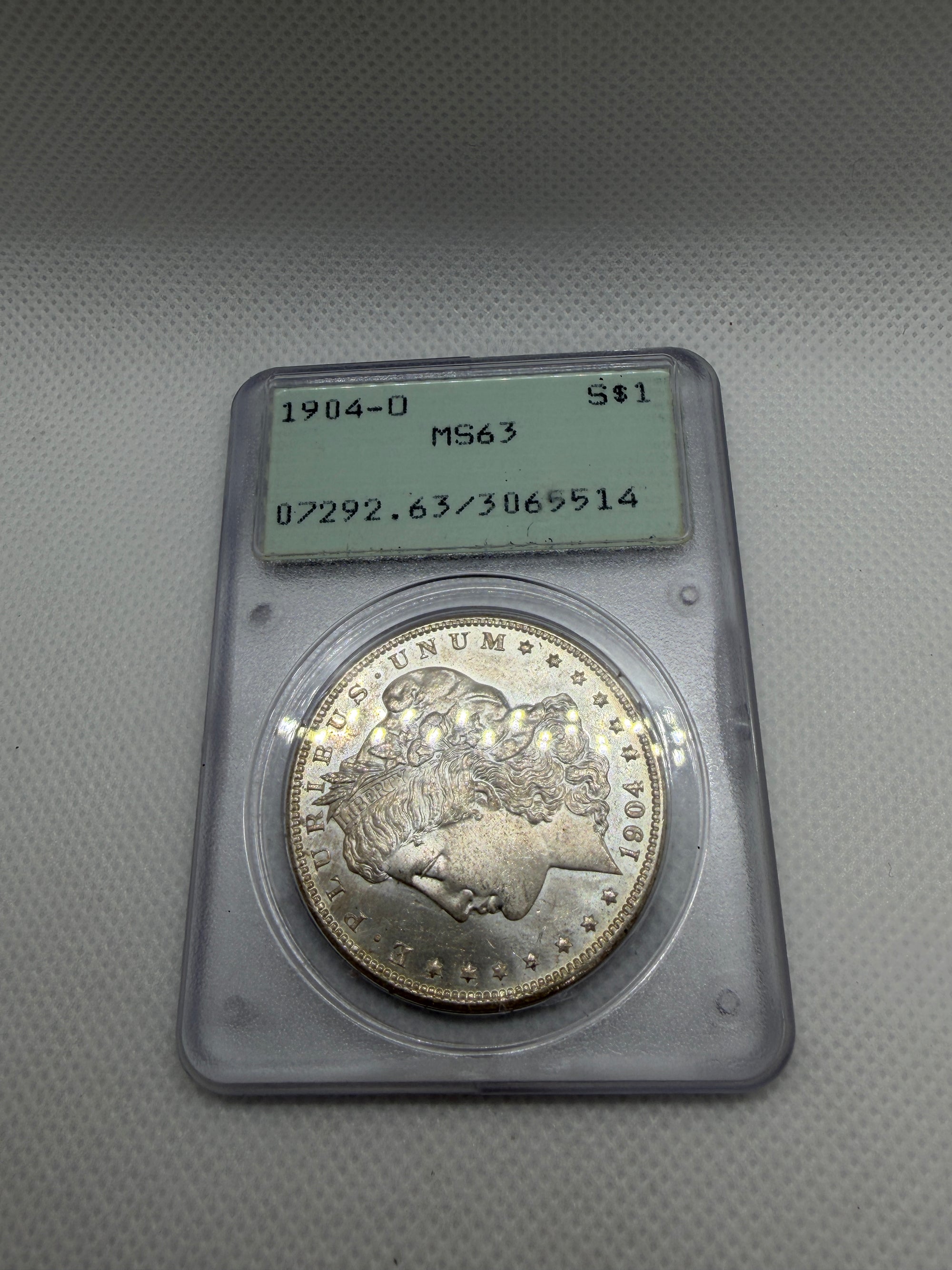 1904 O Morgan Silver Dollar – PCGS MS63 | Old Rattler Holder