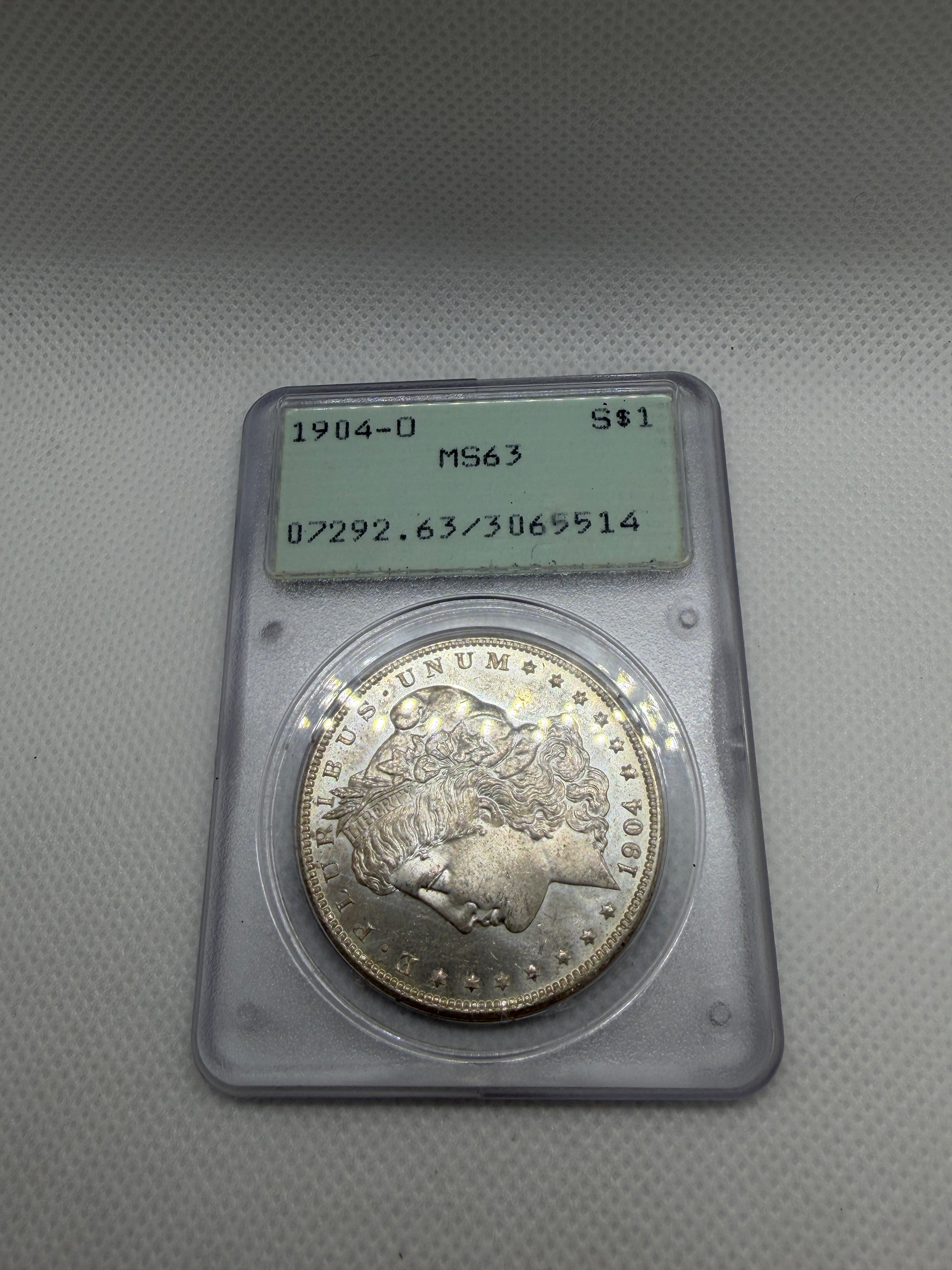 1904 O Morgan Silver Dollar – PCGS MS63 | Old Rattler Holder